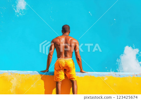 Man stands on diving board ready to jump into bright blue water 123425674