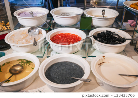Ingredients for traditional Vietnamese iced fruit Che soup in the buffet at the restaurant 123425706