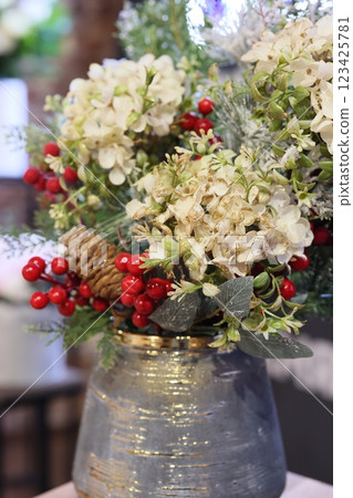 An Elegant and Beautiful Floral Arrangement Featuring Hydrangeas Along with Various Berries 123425781