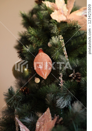 An Elegant Christmas Tree Decoration with Sparkling Colorful Ornaments for the holidays An Elegant Christmas Tree Decoration with Sparkling Colorful Ornaments for the holidays 123425809