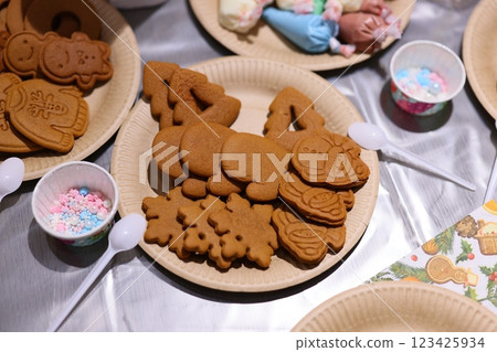 Delicious Festive Gingerbread Cookies Arranged on Plates with Colorful and Fun Sprinkles on Top 123425934