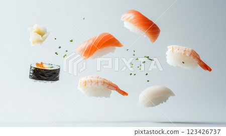 Fresh salmon nigiri, shrimp nigiri, squid nigiri, and sushi rolls with chives levitating on a minimalist white background create a dynamic culinary scene 123426737