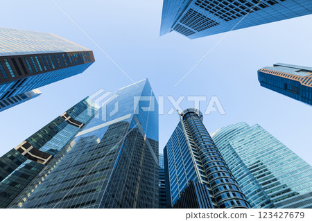 Low-angle building view of the modern office skyscrapers in the financial district of Raffles Place, Singapore. Low-angle building view of the modern office skyscrapers in the financial district of Raffles Place, Singapore. 123427679