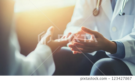 Doctor comforting patient in medical office, showing empathy and care, emphasizing importance of communication in healthcare 123427867