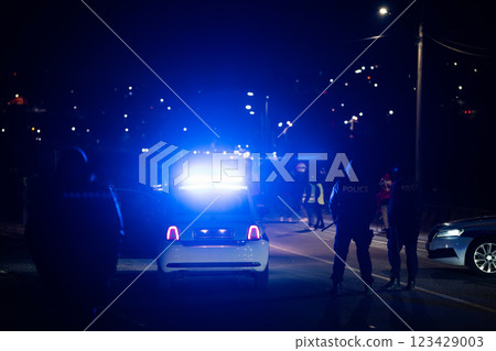 Road police blocked traffic at night 123429003