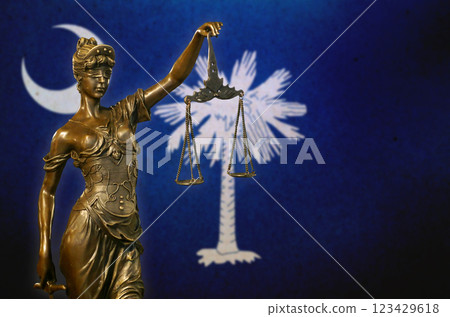 Lady Justice before a flag of South Carolina Lady Justice before a flag of South Carolina 123429618