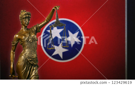 Lady Justice before a flag of Tennessee 123429619