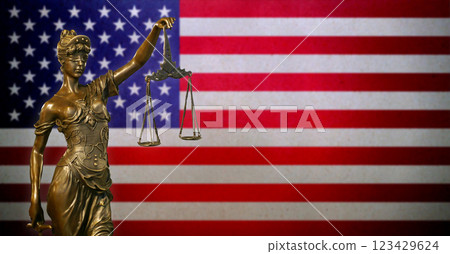 Lady Justice before a flag of the American flag 123429624