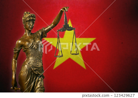Lady Justice before a flag of Vietnam 123429627