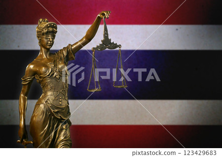 Lady Justice before a flag of Thailand 123429683