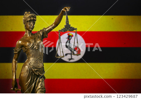 Lady Justice before a flag of Uganda Lady Justice before a flag of Uganda 123429687