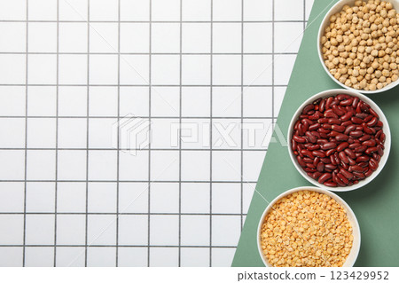 Beans in bowls on light background, space for text 123429952