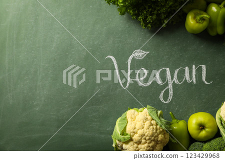 Set of protein vegetables and word Vegan on green background, space for text 123429968