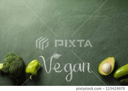 Set of protein vegetables and word Vegan on green background, space for text 123429970