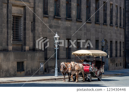 Horse drawn carriage, popular form of sightseeing for tourists visiting historic Old town district of Dresden, Saxony, Germany Horse drawn carriage, popular form of sightseeing for tourists visiting historic Old town district of Dresden, Saxony, Germany 123430446