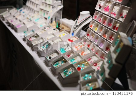 A Vibrant and Colorful Jewelry Display at a Charming Market Stall Filled with Unique Treasures A Vibrant and Colorful Jewelry Display at a Charming Market Stall Filled with Unique Treasures 123431176