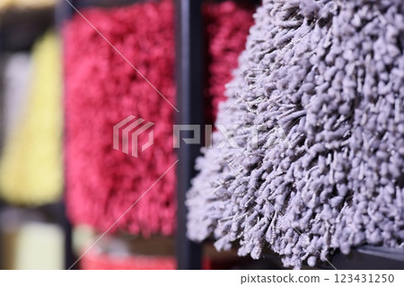 A Colorful and EyeCatching Display of Various Textured Fabrics Presented on Shelves A Colorful and EyeCatching Display of Various Textured Fabrics Presented on Shelves 123431250