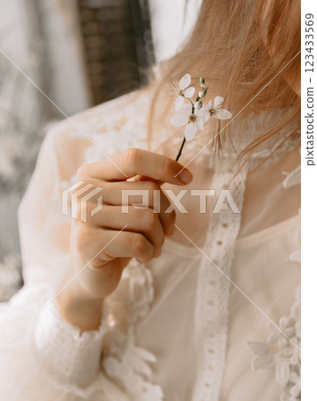 Woman holding a branch with flowers. Spring beauty concept Woman holding a branch with flowers. Spring beauty concept 123433569