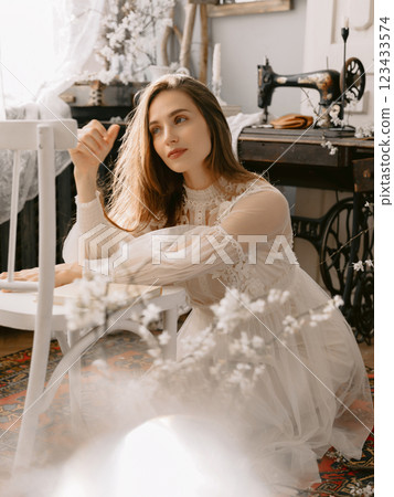 Attractive woman wearing vintage style pastel dress. Spring fashion concept 123433574