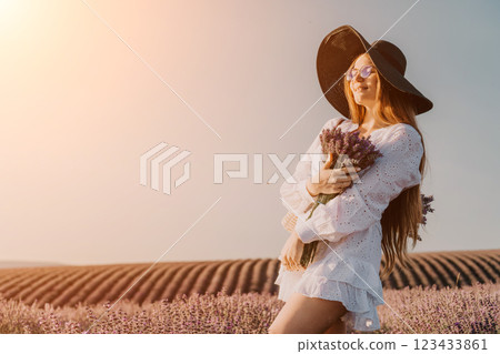 Woman in White Dress and Hat in Lavender Field Woman in White Dress and Hat in Lavender Field 123433861