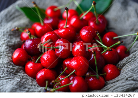 Heap of freshly washed red cherries with water droplets 123434267
