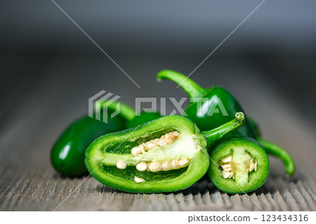 Macro shot of half green mexican jalapeno hot pepper 123434316