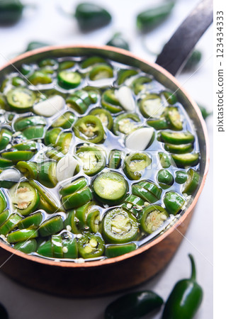 Prepared green mexican jalapeno hot peppers for pickling Prepared green mexican jalapeno hot peppers for pickling 123434333