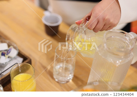 Preparing a refreshing beverage that features a delightful citrus infusion for enjoyment 123434404