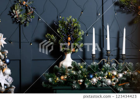 Christmas decor on the top of a green piano. New Year's items in the room 123434423