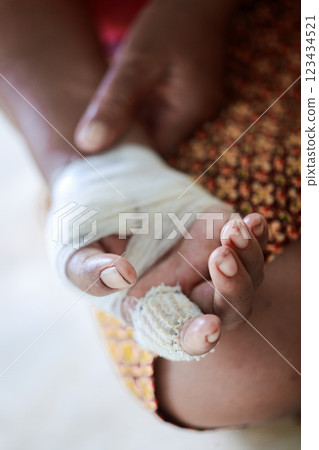 Hand of woman injured and bandaged Hand of woman injured and bandaged 123434521