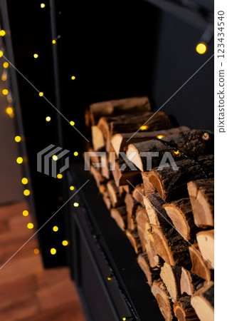 real logs for kindling the Christmas stove. logs in the fireplace 123434540