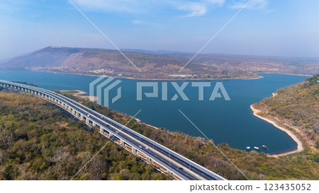 Drone shot aerial view landscape of the M6  motorway Expressway Nakhon Ratchasima Province - Bang Pa-in. Lam Ta Khong River and Mountain. Drone shot of scenic landscape rural place traffic. Nakhon 123435052