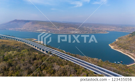 Drone shot aerial view landscape of the M6  motorway Expressway Nakhon Ratchasima Province - Bang Pa-in. Lam Ta Khong River and Mountain. Drone shot of scenic landscape rural place traffic. Nakhon 123435056