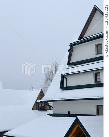 snow on the roofs of houses 123435222