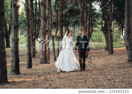 walk of the bride and groom through the autumn forest walk of the bride and groom through the autumn forest 123435553