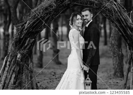walk of the bride and groom through the autumn forest 123435585