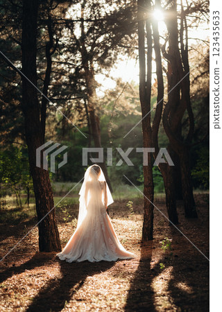 girl in a wedding dress in the autumn forest 123435633