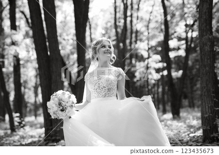 young girl bride in a white dress in a spring forest 123435673