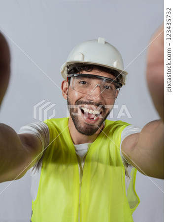 Funny builder engineer taking a selfie isolated, Engineer taking a selfie isolated. View of male engineer taking a selfie isolated, Smiling male engineer taking a selfie looking at camera Funny builder engineer taking a selfie isolated, Engineer taking a selfie isolated. View of male engineer taking a selfie isolated, Smiling male engineer taking a selfie looking at camera 123435732