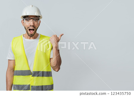 Surprised face construction worker pointing at an advertisement. Engineer man pointing to side. Surprised face engineer pointing finger to the right, Surprised engineer pointing to the side Surprised face construction worker pointing at an advertisement. Engineer man pointing to side. Surprised face engineer pointing finger to the right, Surprised engineer pointing to the side 123435750