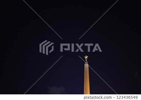 The enchanting night view of a magnificent monument illuminated by a brilliant star 123436549