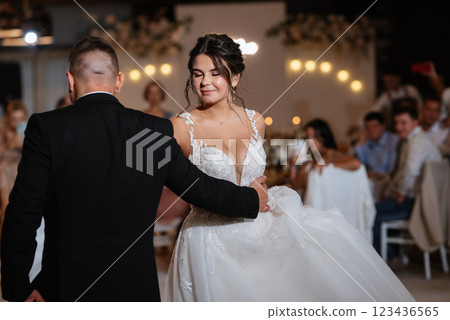 the first dance of the bride and groom inside a restaurant 123436565