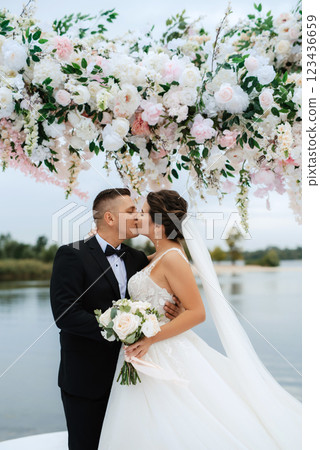 wedding ceremony of the newlyweds on the pier 123436659