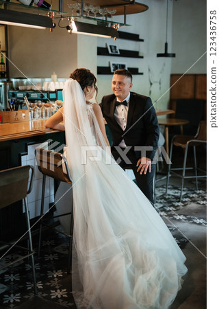 bride and groom inside a cocktail bar 123436758