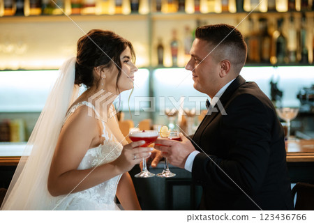 bride and groom inside a cocktail bar 123436766