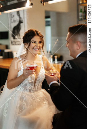 bride and groom inside a cocktail bar bride and groom inside a cocktail bar 123436775