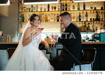 bride and groom inside a cocktail bar 123436776