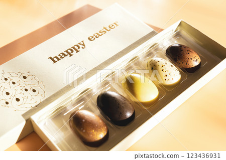 A box of chocolate eggs with the inscription in English Happy Easter. A box of chocolate eggs with the inscription in English Happy Easter. 123436931