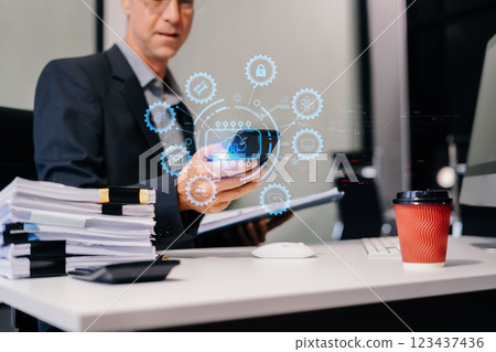 Businessman is using a smartphone to access the cloud computing system, Storage and data transfer Cloud network, Cloud technology. Businessman is using a smartphone to access the cloud computing system, Storage and data transfer Cloud network, Cloud technology. 123437436