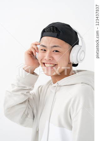 Male teenager portrait headphones 123437837